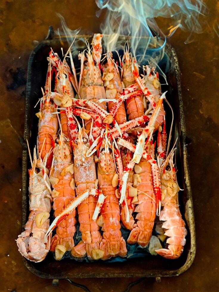 Fresh crayfish roasted using the rustic method smoke photo