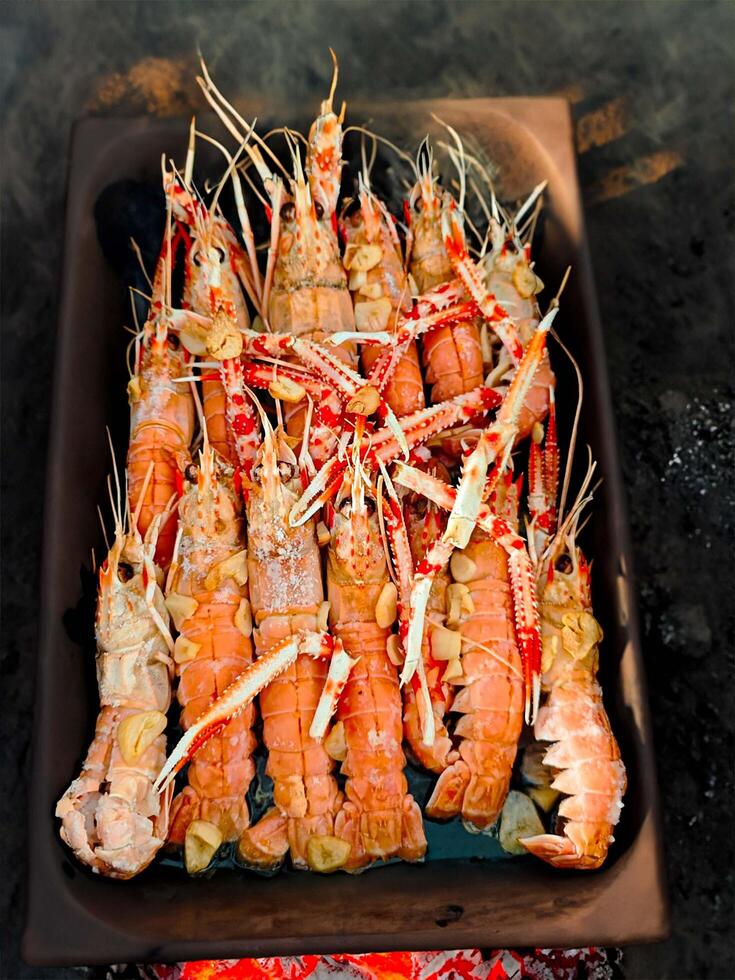 Fresh crayfish roasted using the rustic method hot photo