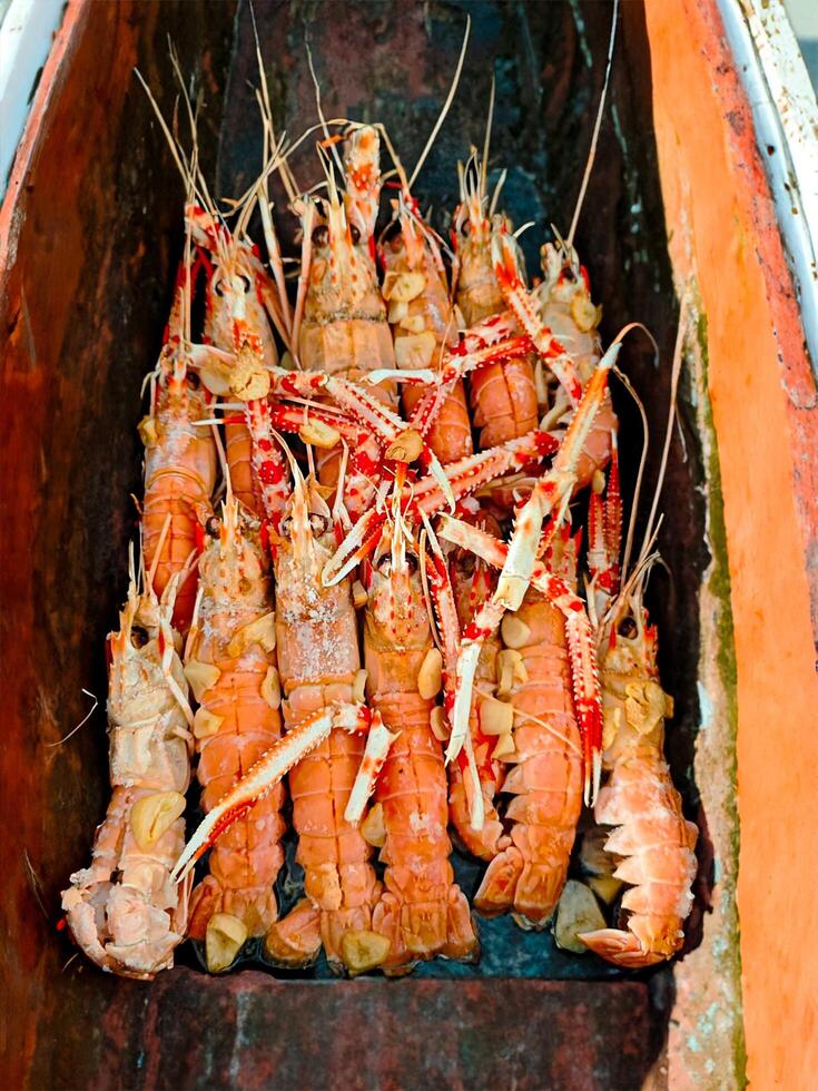 Fresh crayfish roasted using the rustic method rustic wood photo