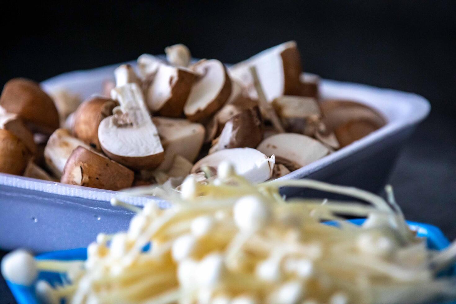 known as Enokitake, the Enoki mushroom Flammulina velutipes, is a variety widely used in oriental cuisine only the best photo