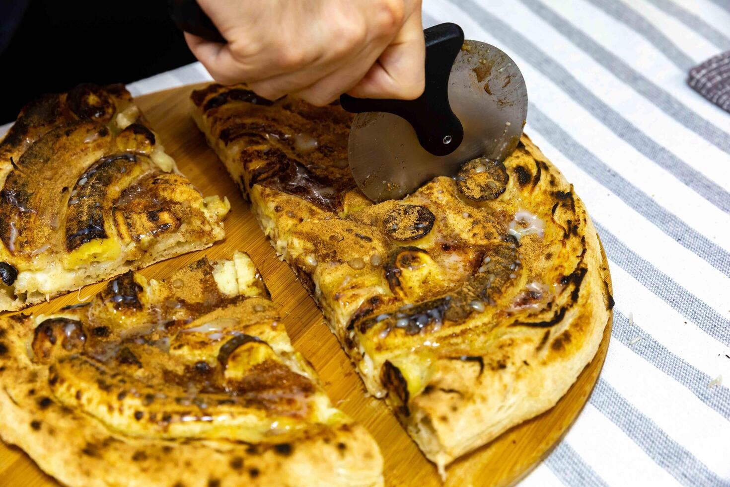 Traditional Brazilian sweet banana pizza with cinnamon and condensed milk. The best pizza in the world c photo