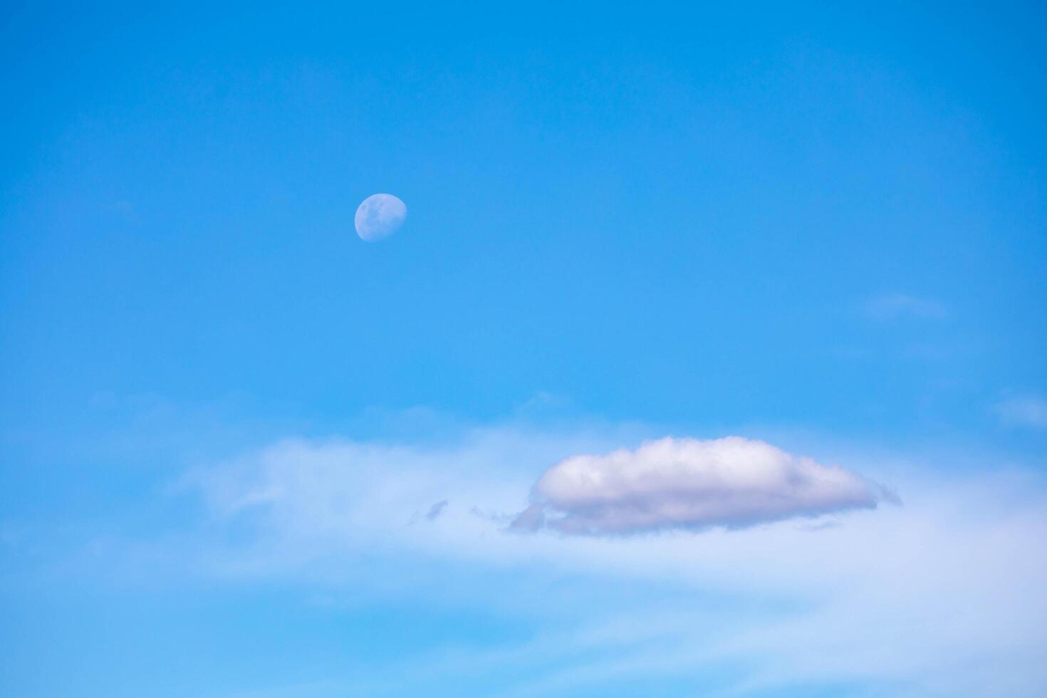 The Moon in the Blue Sky with Clouds, photo