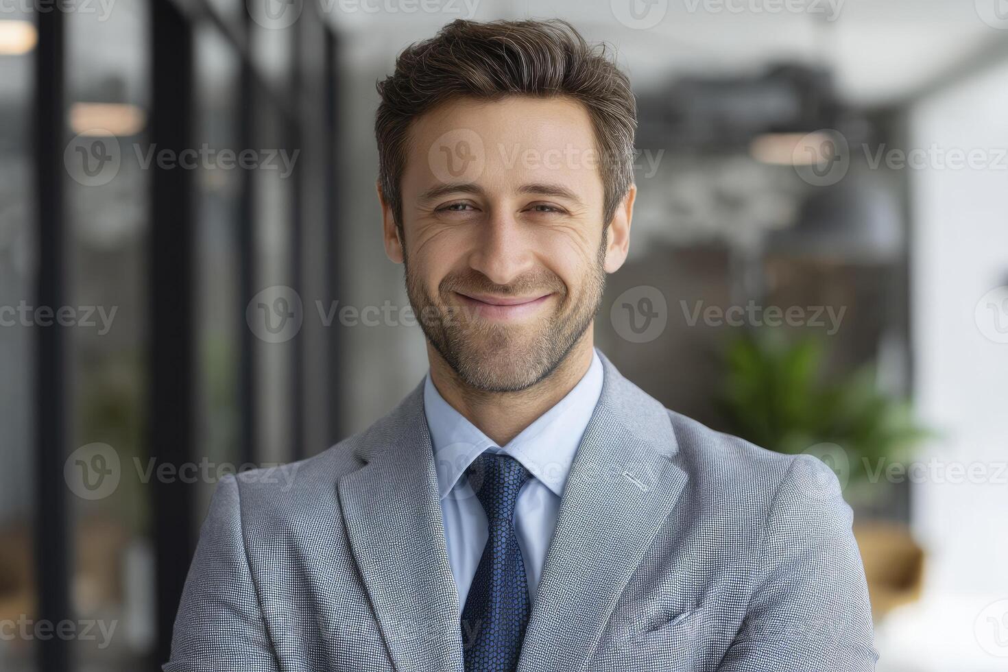 A man in a suit and tie smiling photo