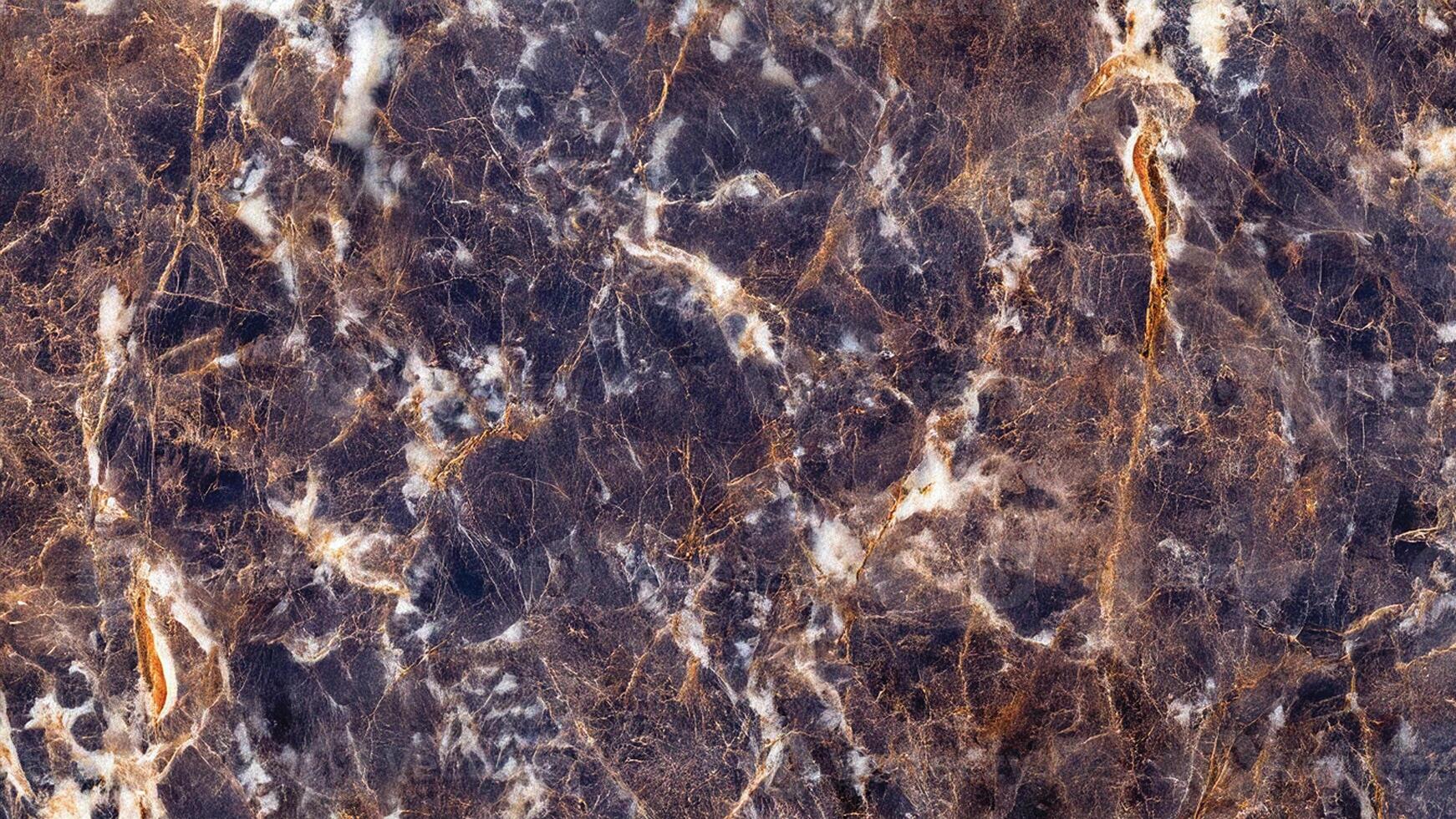 Dark navy and gold veined marble dramatic and rich stone surface photo