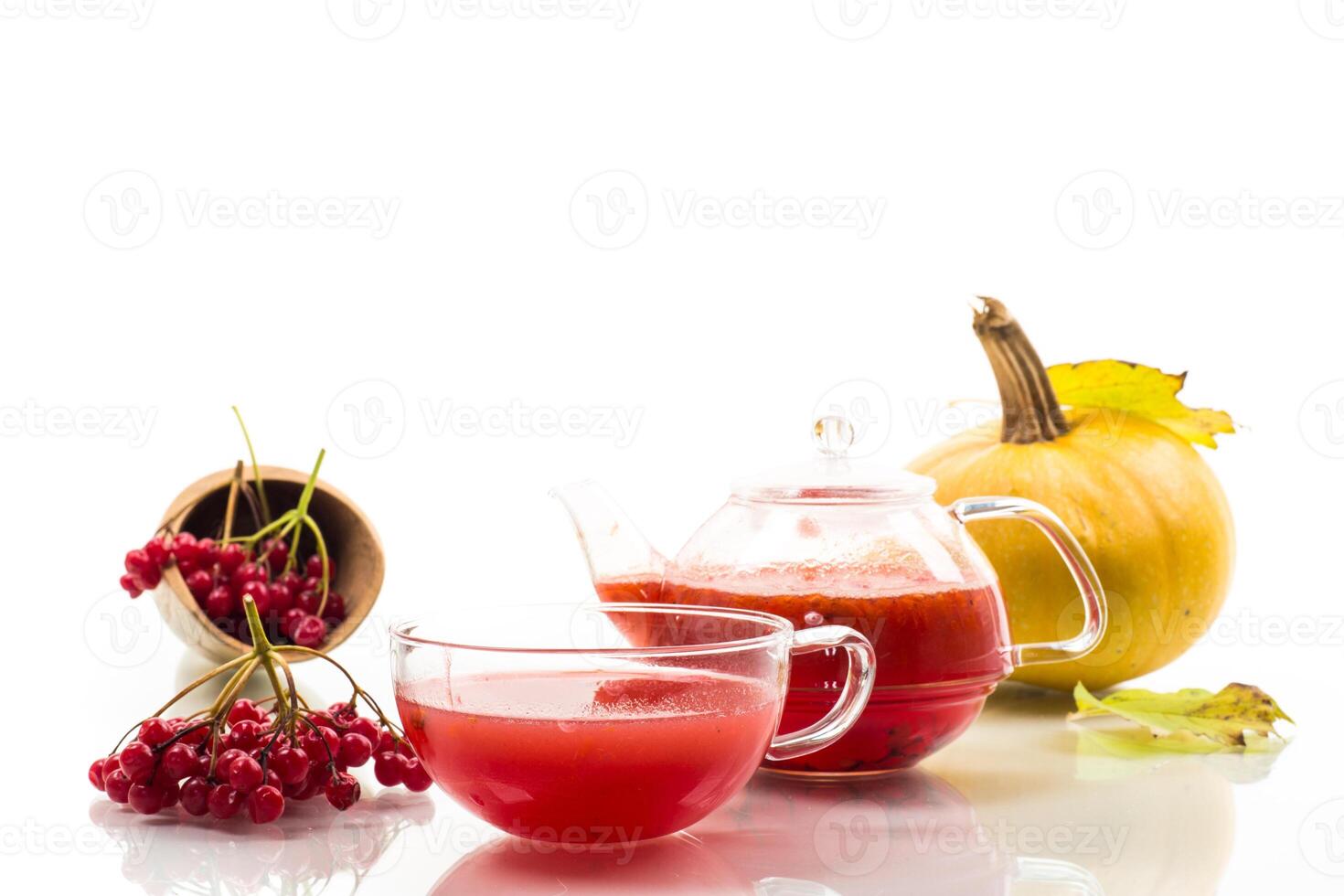 Medicinal tea. tea from ripe red viburnum isolated on white background photo