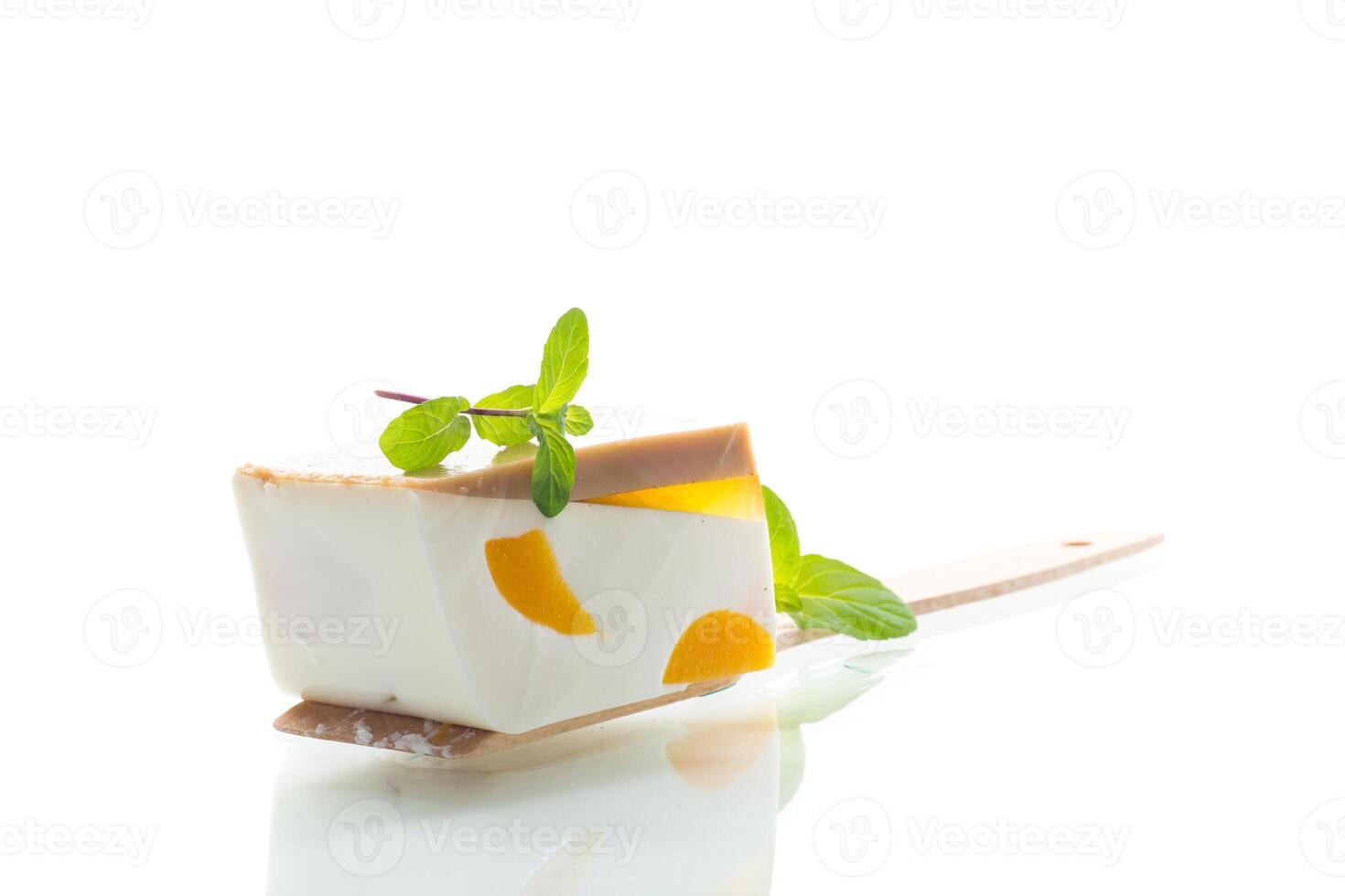 Simple dessert. milk jelly dessert with fruit pieces photo