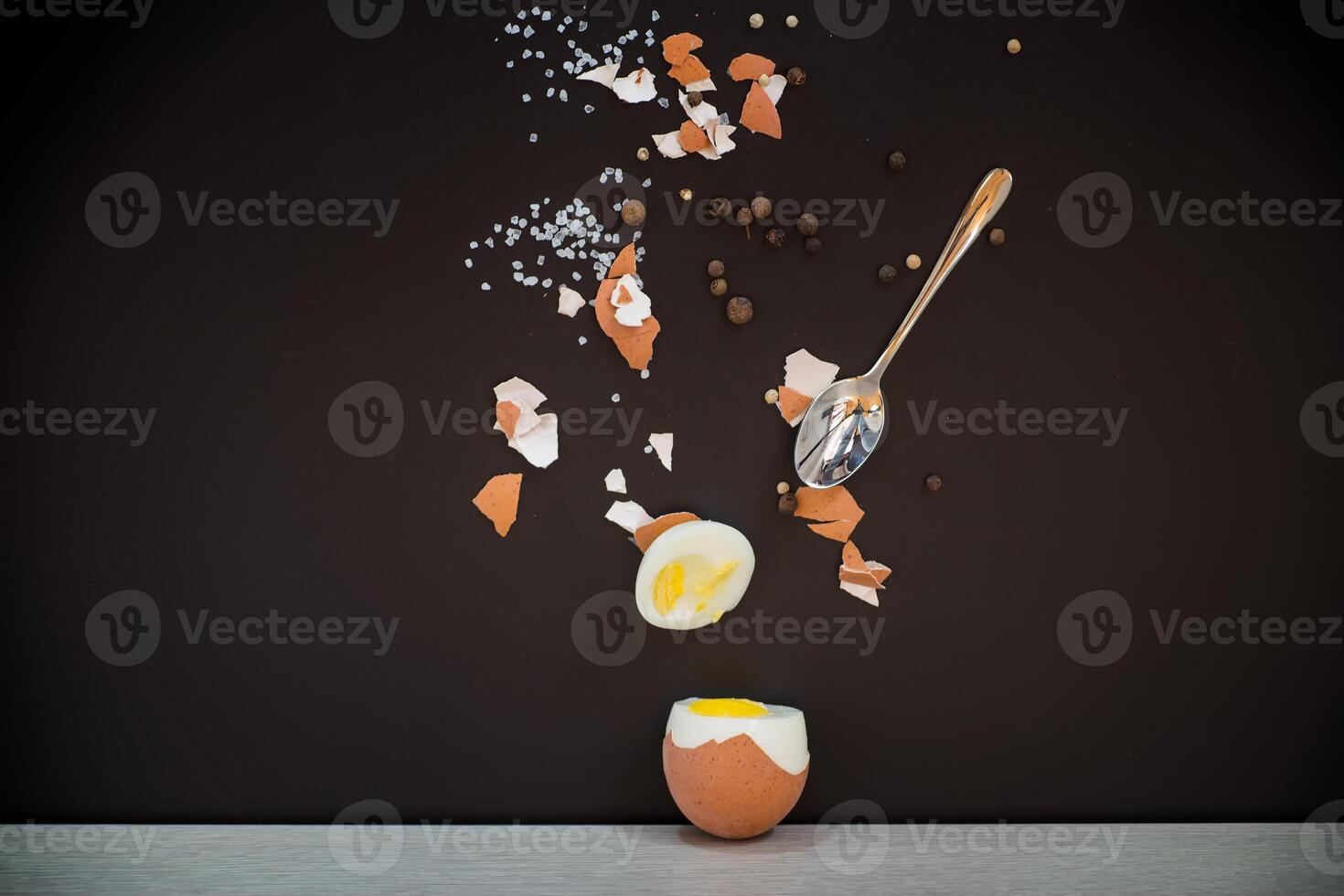 Broken shell, spices and spoon in artistic composition photo