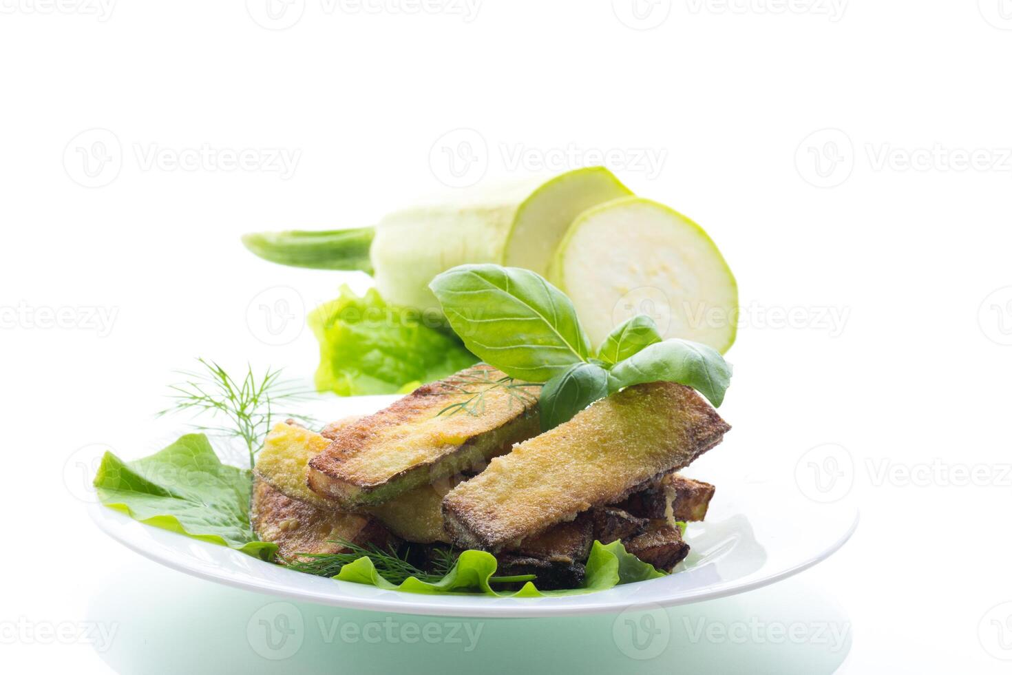 Zucchini with a crispy crust and fresh salad photo