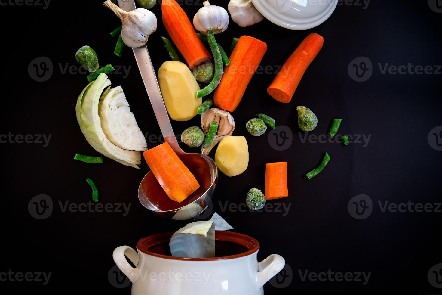 Vegetables in motion before cooking in soup . Food photo