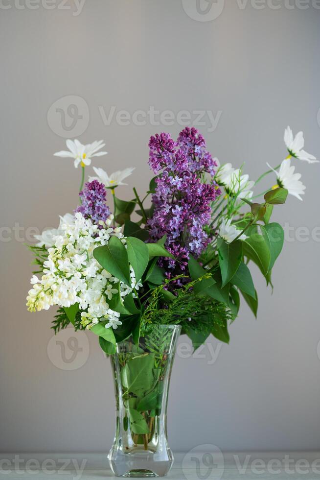floral arrangement of lilacs on a gray background photo
