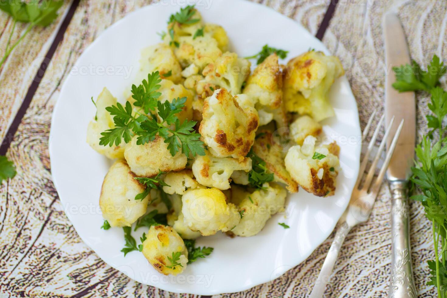 Rustic vegetable dish with cabbage and herbs, top view photo