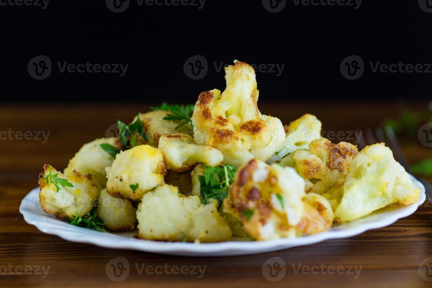 Top view of crispy cauliflower with parsley photo