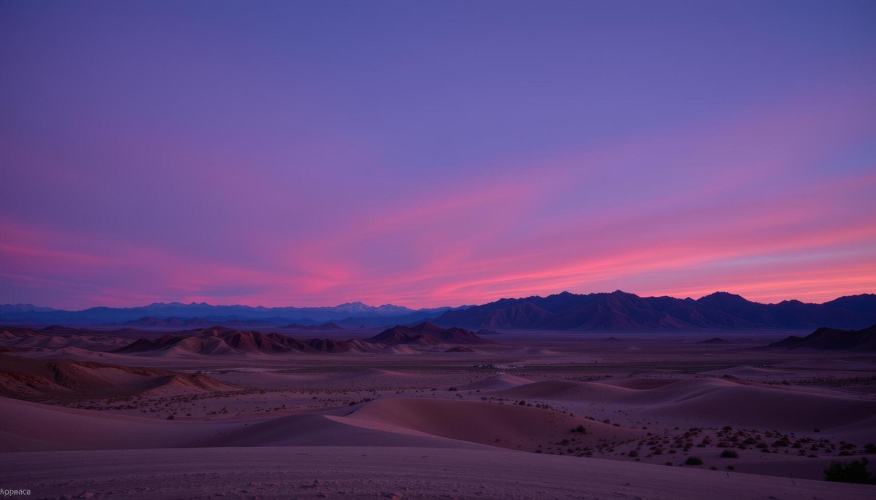 a twilight colored desert under a violet sky, where every ridge glows faintly in the dying light. photo