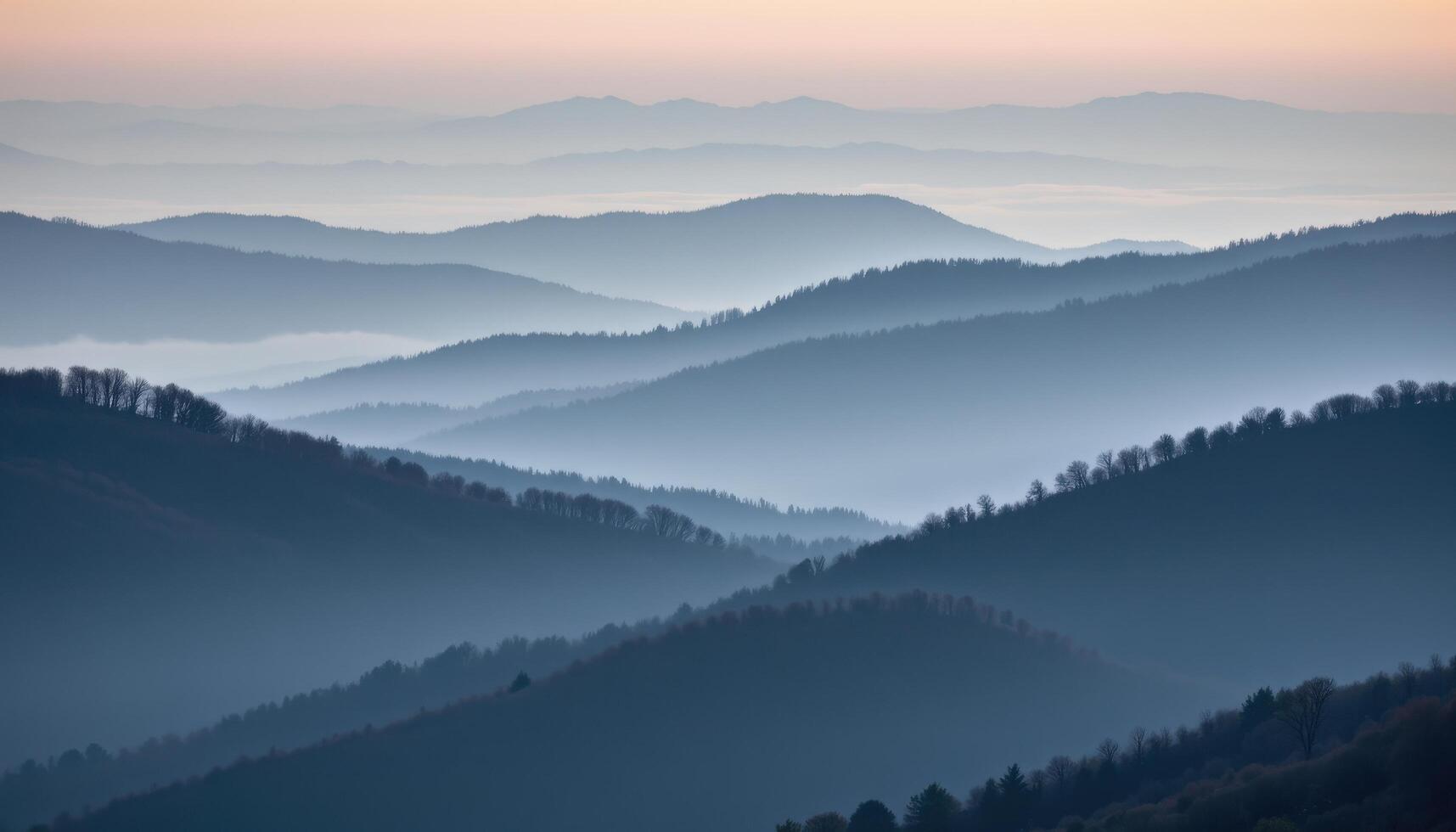 foggy hills layered in fading shades of grey and blue. photo