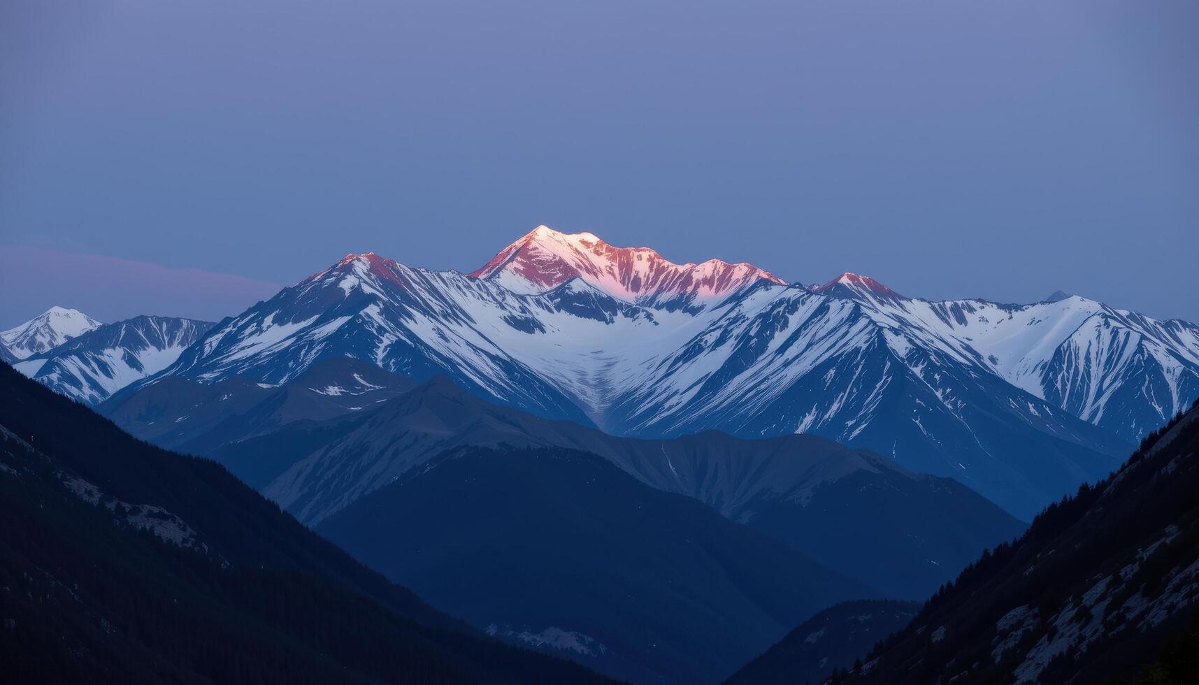 a moonlit mountain landscape with snow peaks glowing softly. photo