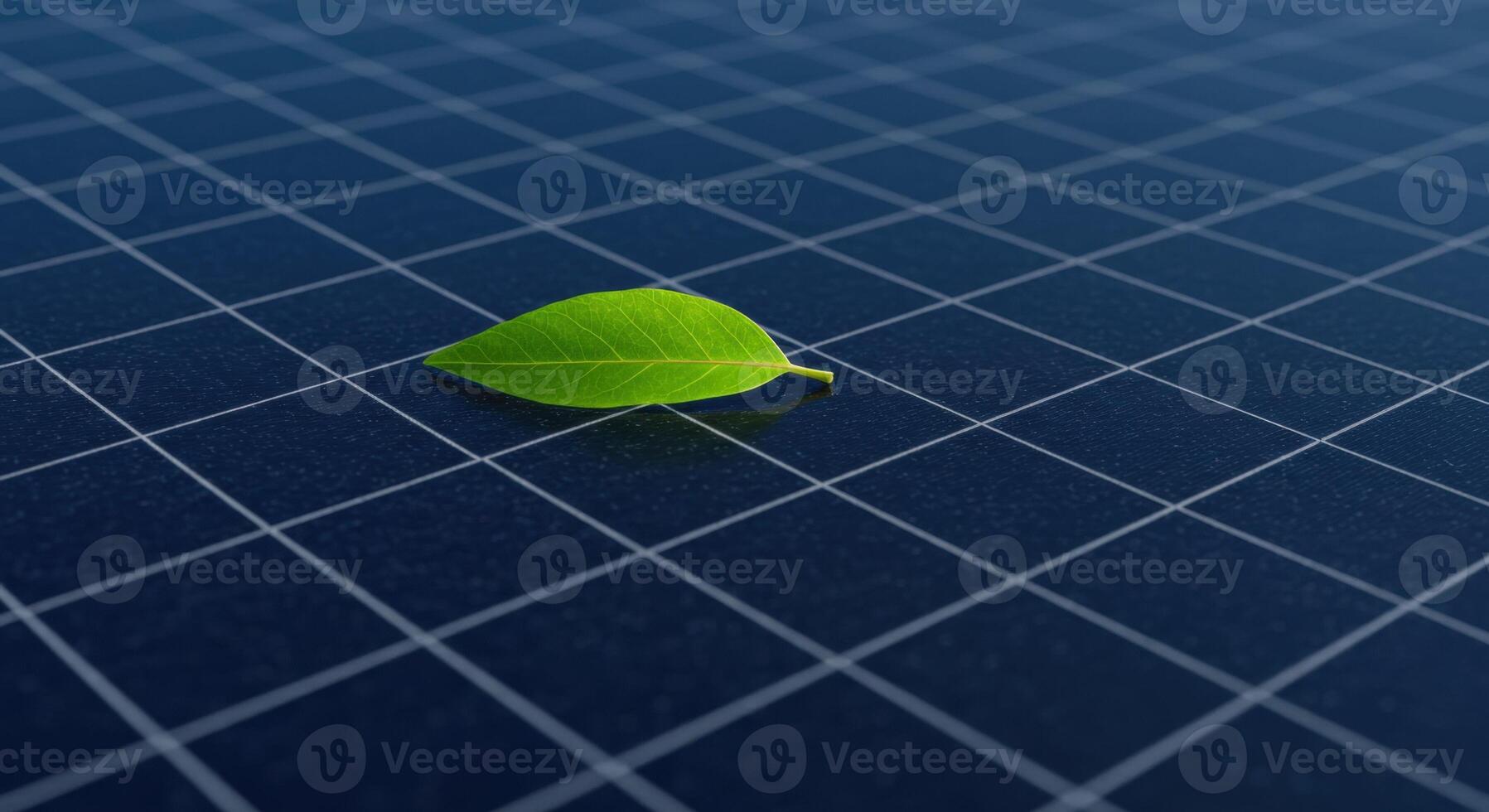 Green Leaf on Blue Grid Surface Representing Solar Energy and Sustainable Technology photo