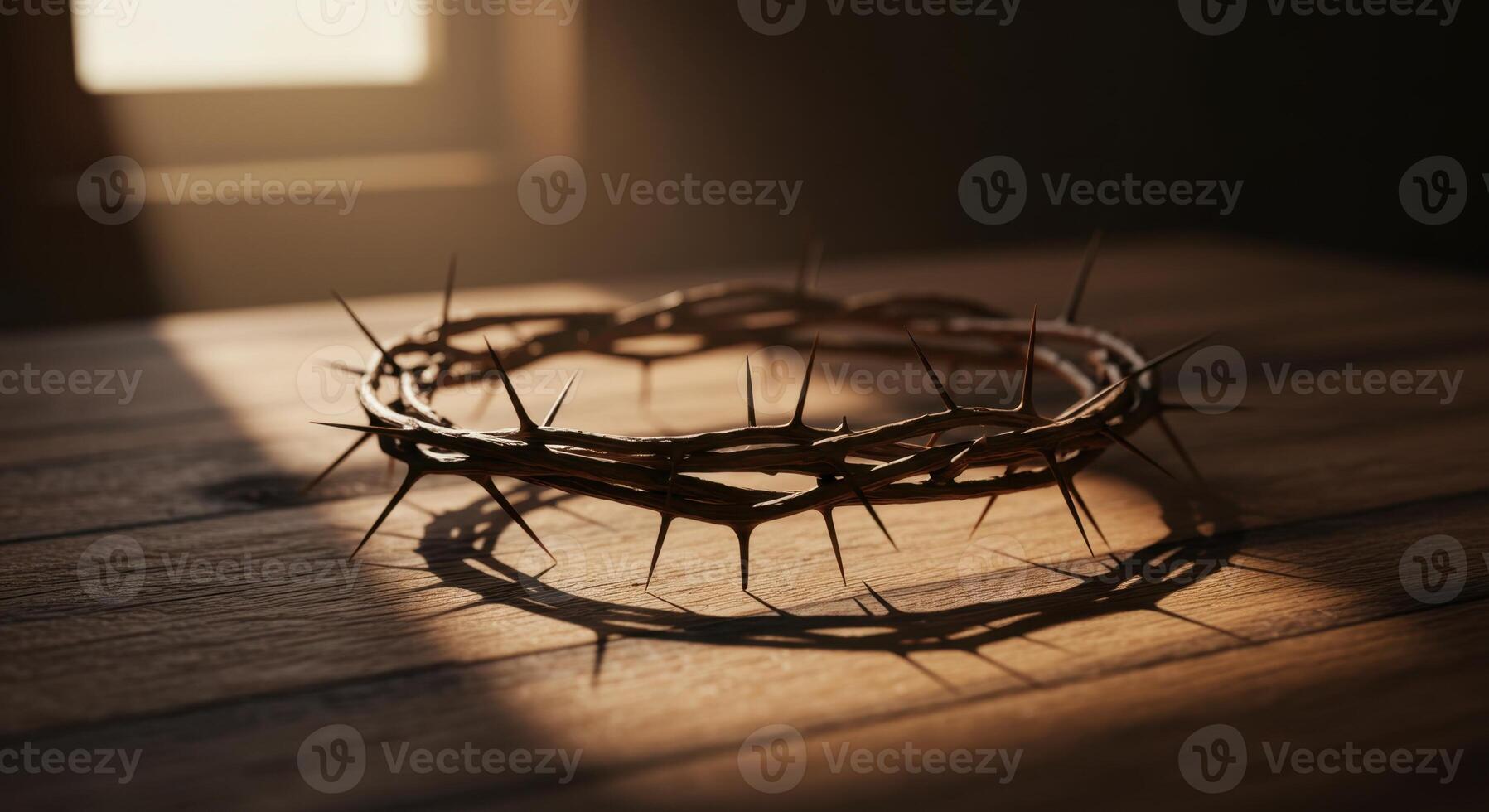 Crown of Thorns on Wooden Table with Sunlight and Shadow, Symbol of Christian Faith photo