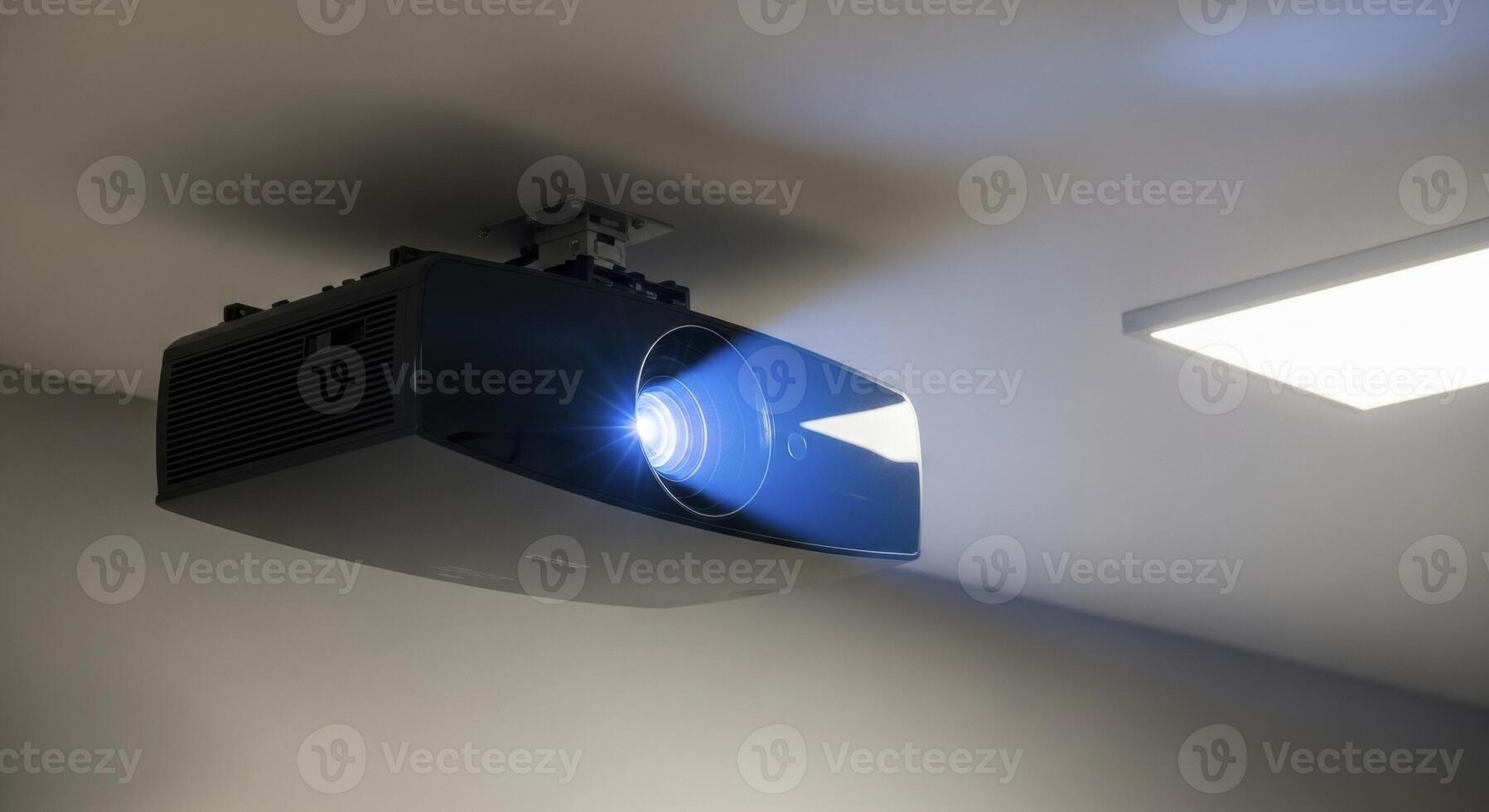 Sleek black projector mounted on a ceiling, casting a bright blue light in a modern room. photo