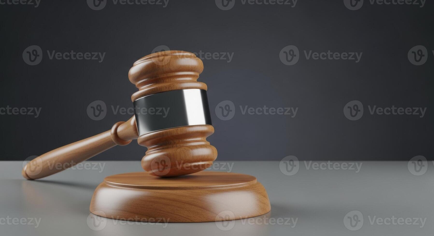 Wooden Judge Gavel with Silver Band on a Table, Symbolizing Law and Justice photo