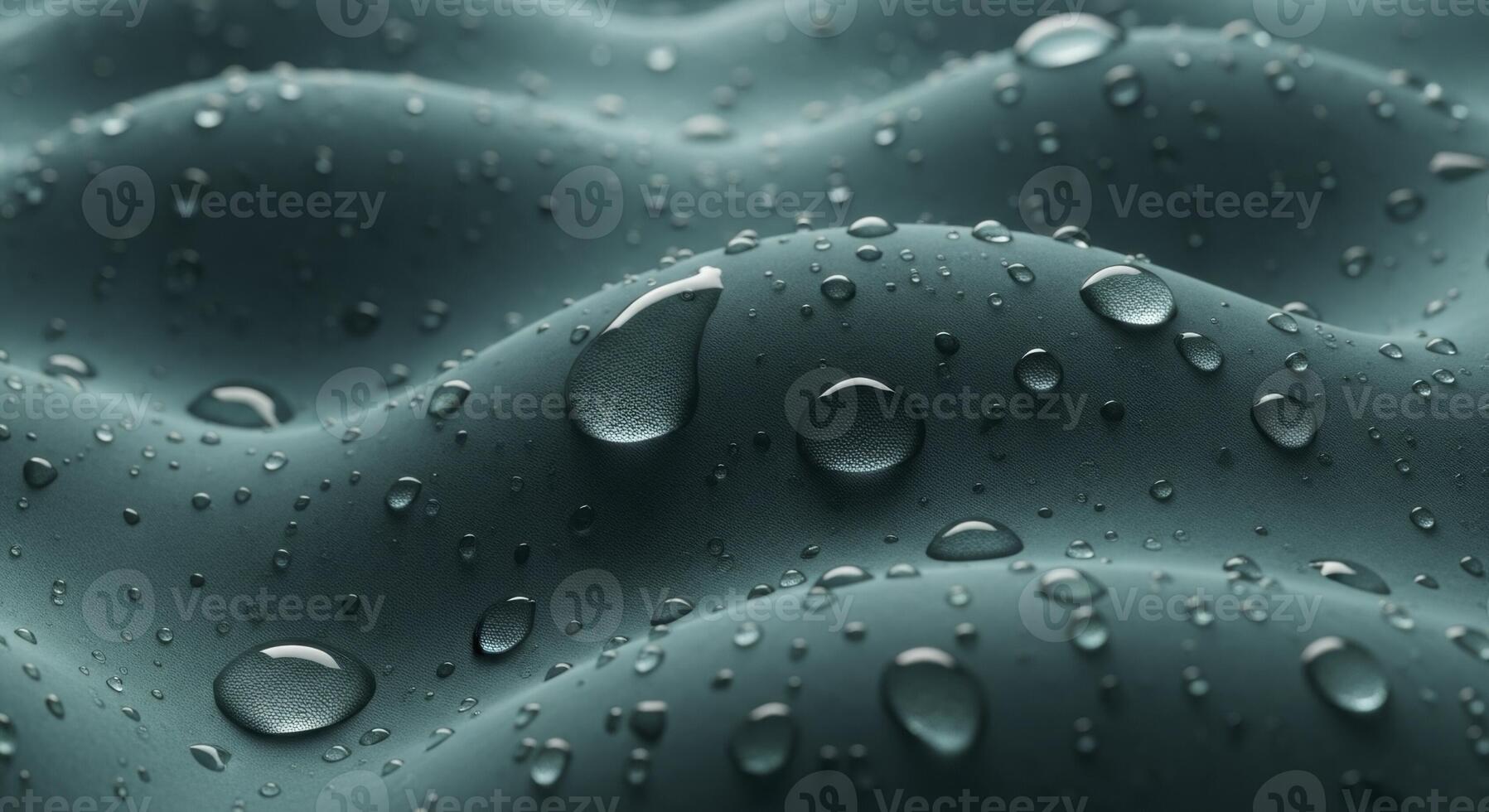 Water droplets on a wavy textured teal surface showing hydrophobic properties photo