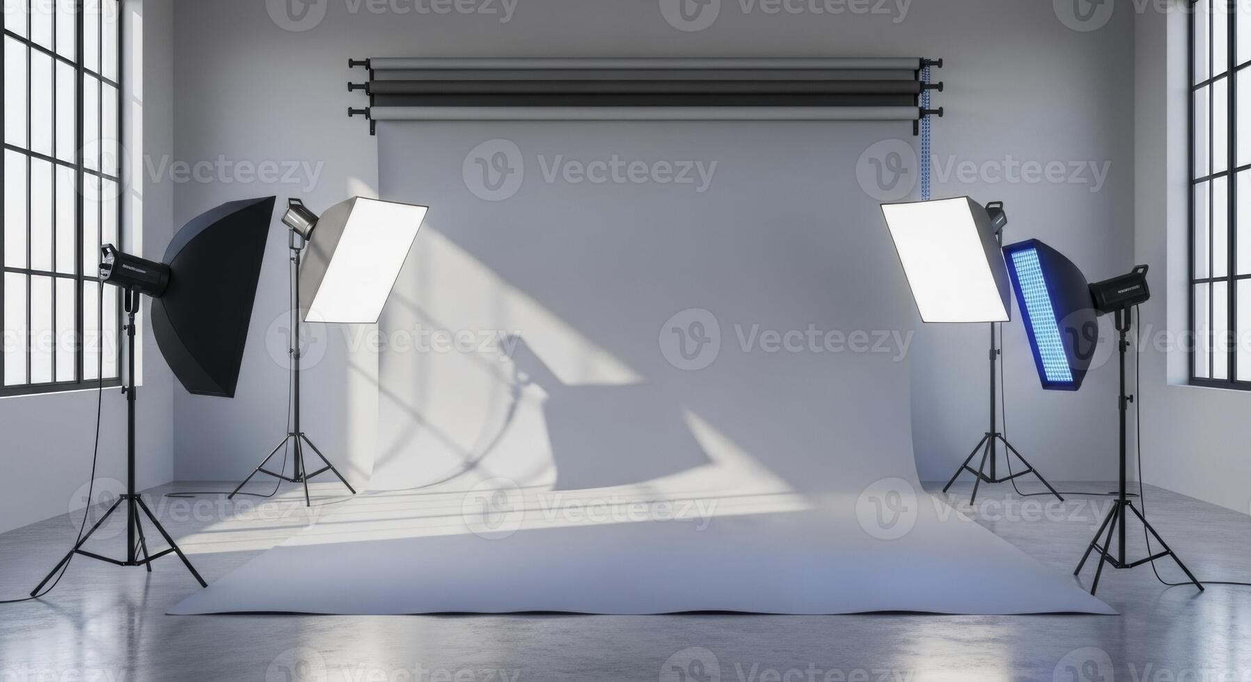 Empty professional photography studio with grey seamless backdrop and lighting equipment photo