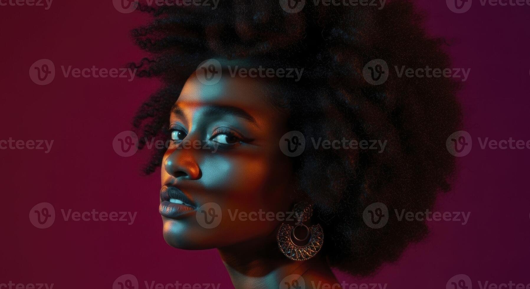 Striking studio portrait of a Black woman with afro and colorful light photo
