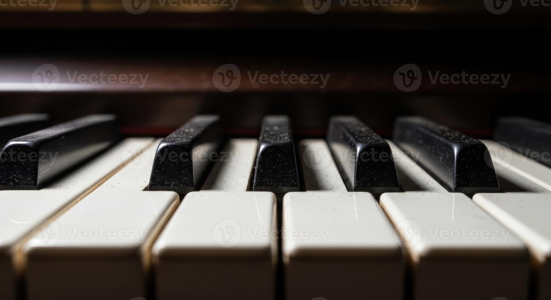 Close up low angle view of vintage black and white piano keys with dramatic lighting photo