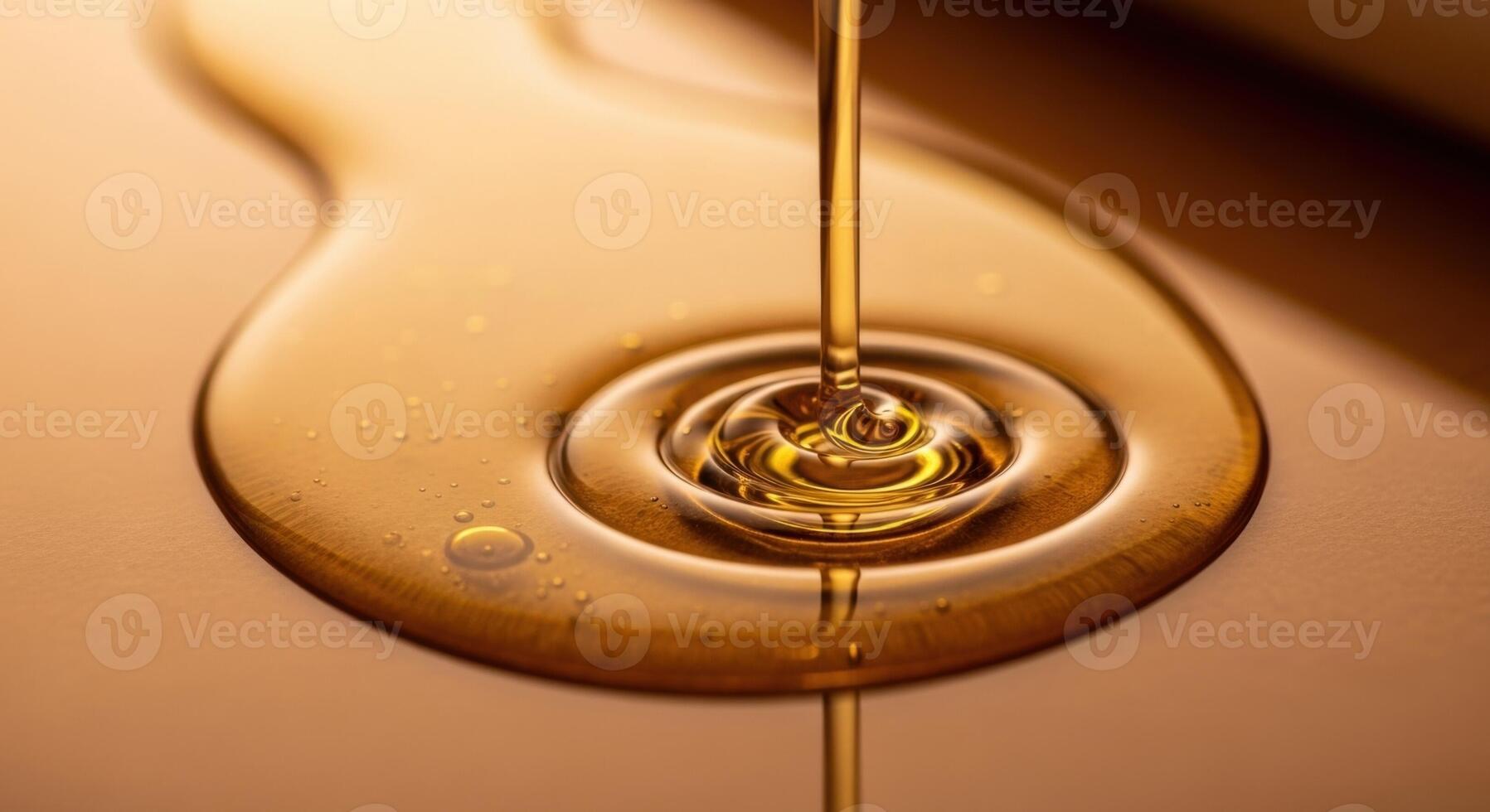 Golden viscous liquid pouring and spreading, highlighting its rich texture and natural flow photo