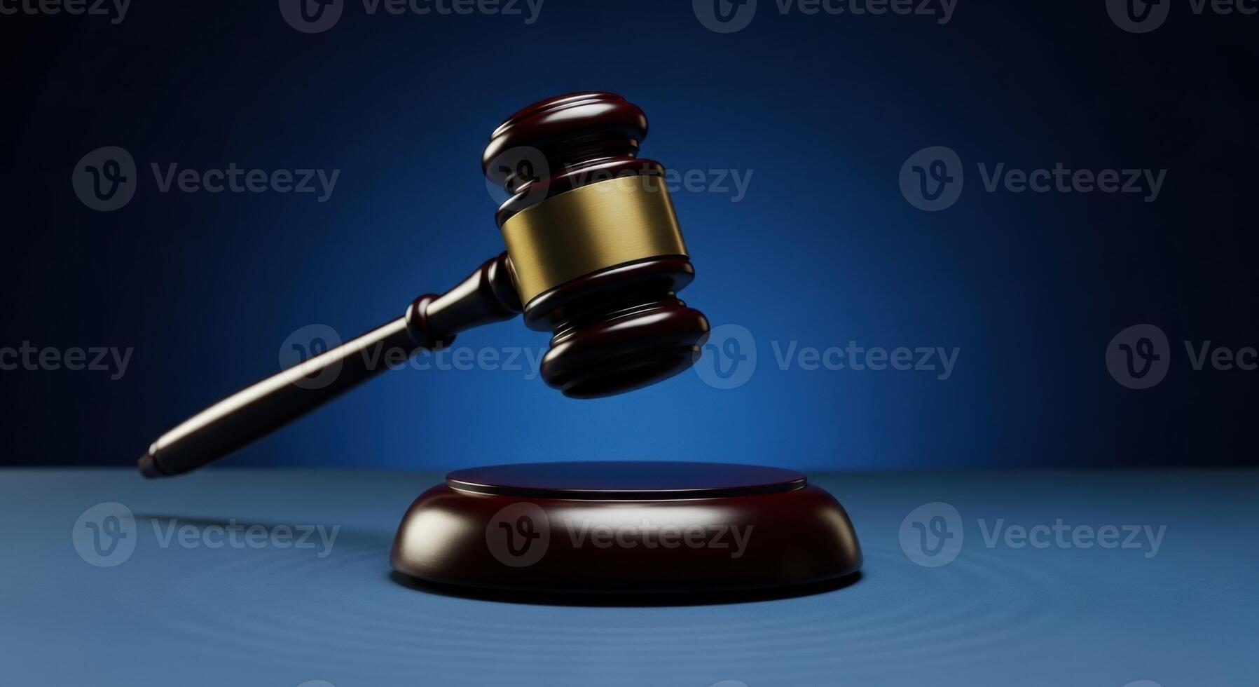Wooden Judge Gavel Poised Above Sound Block Symbolizing Law and Justice photo
