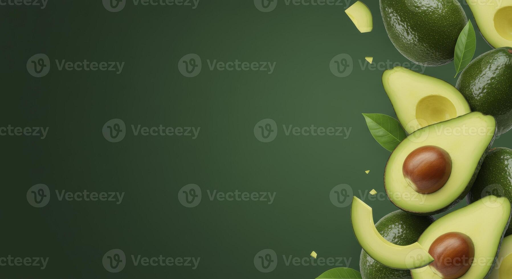 Fresh Avocados and Green Leaves Falling on a Dark Green Background with Copy Space photo