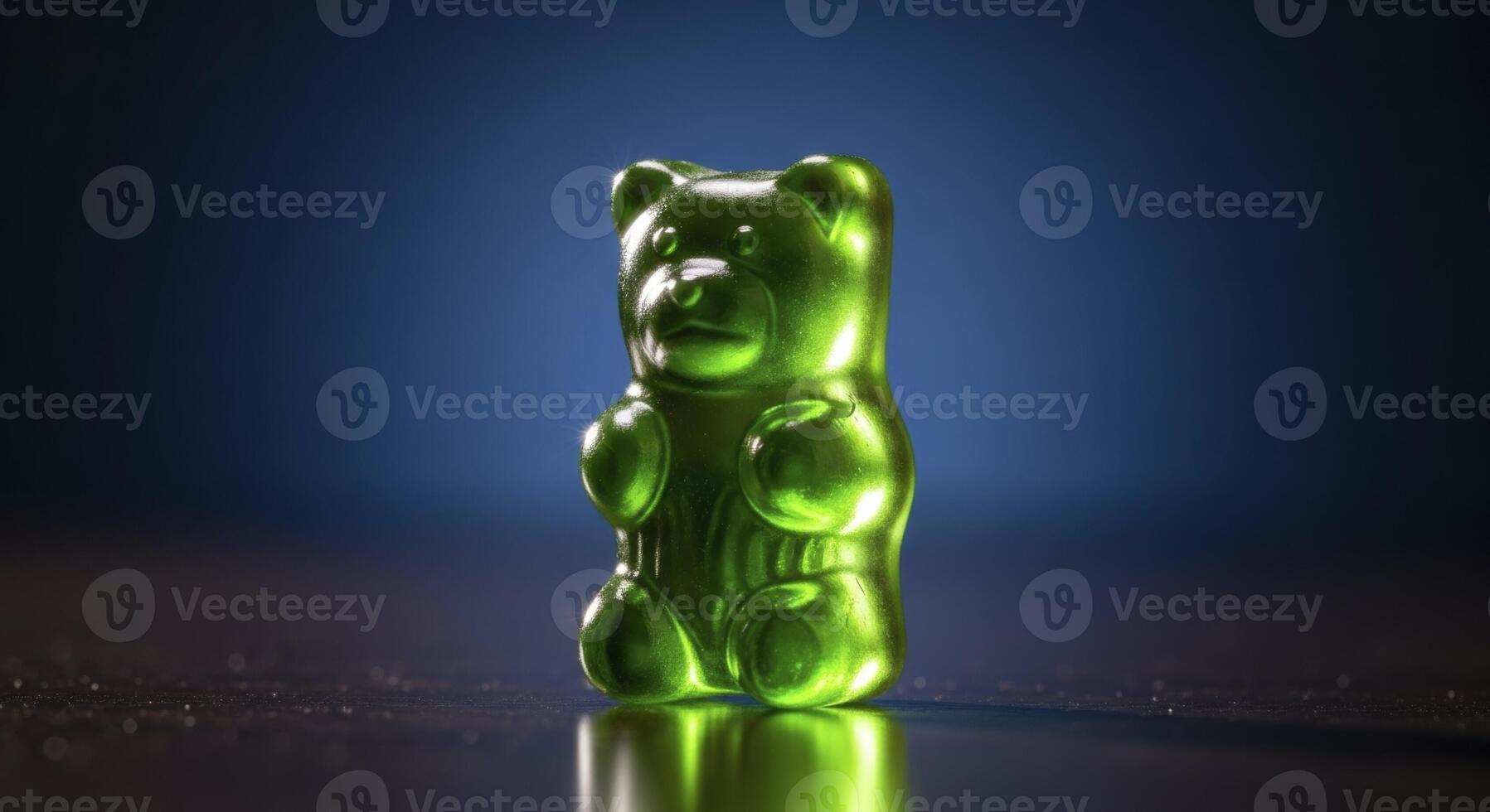 Vibrant Green Gummy Bear Candy Standing on a Reflective Surface with Studio Lighting photo
