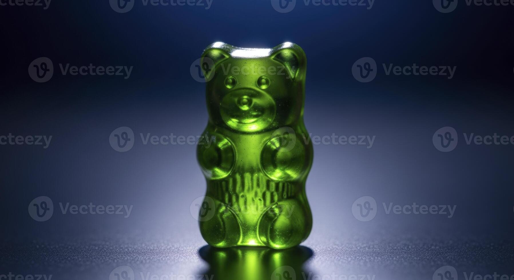 Vibrant Green Gummy Bear Candy with Translucent Glossy Finish on Dark Background photo