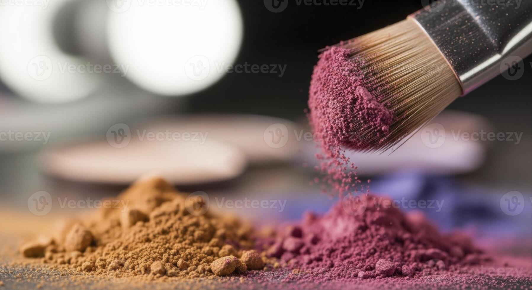Makeup brush applying vibrant pink cosmetic powder onto a pile of pigments photo