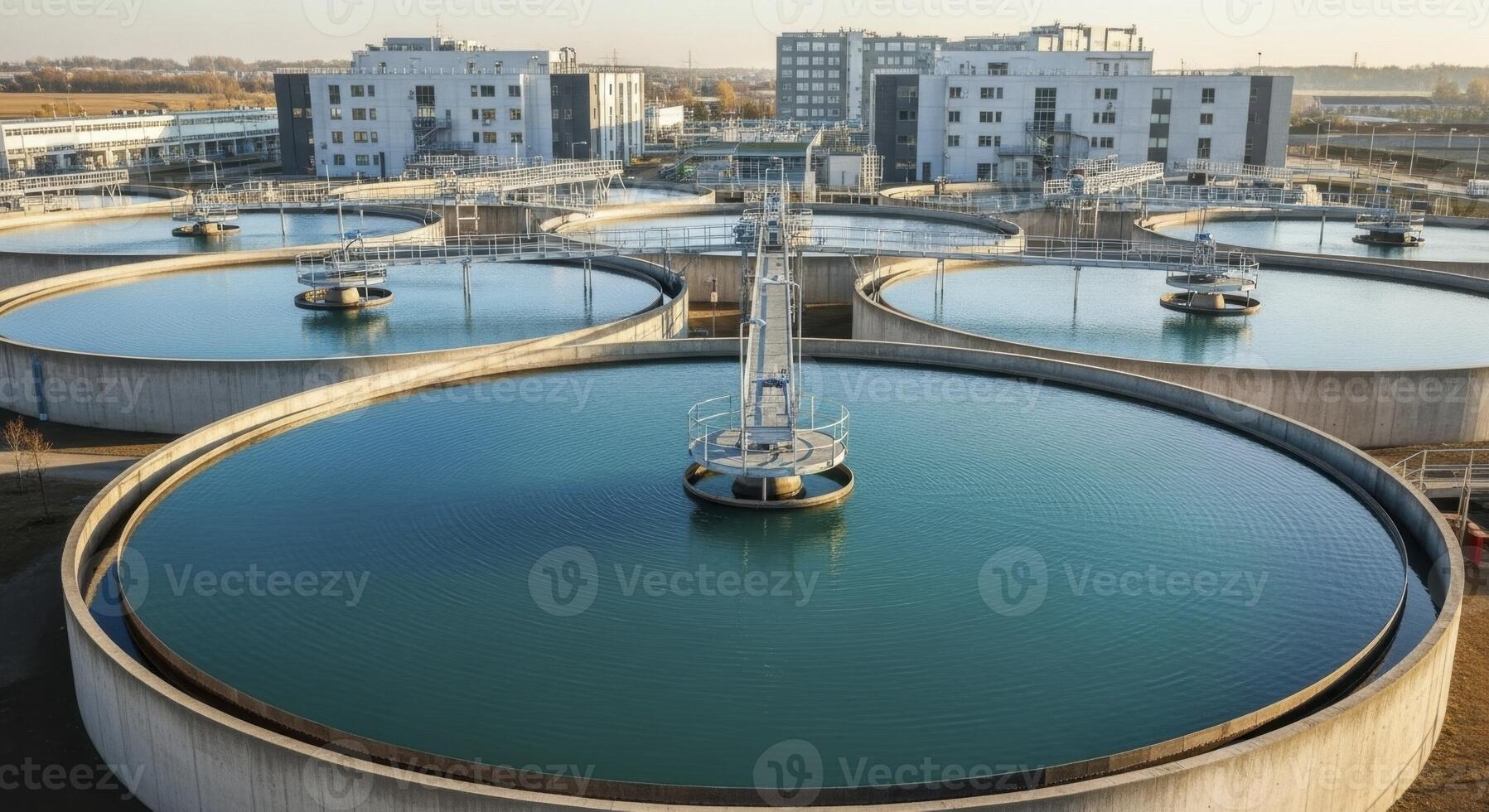 Modern Water Treatment Plant with Circular Tanks for Environmental Purification photo