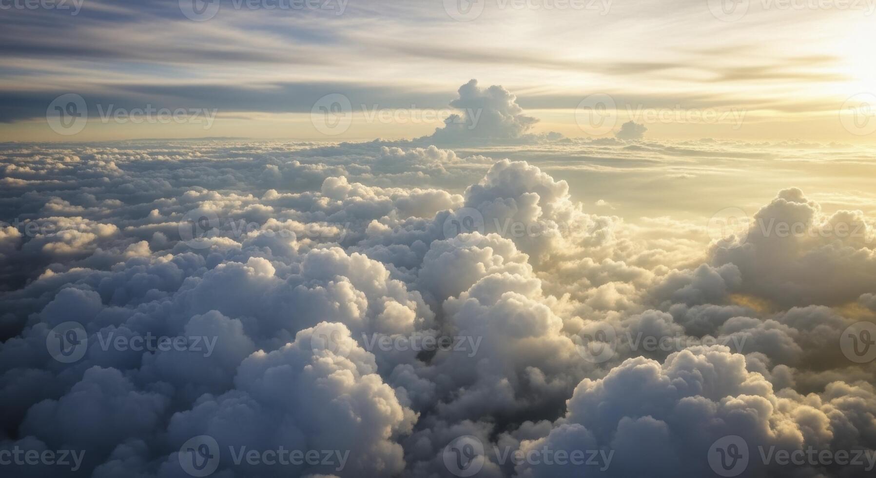 Golden Sunlight Illuminates a Vast Expanse of Fluffy Cumulus Clouds From an Aerial Perspective photo