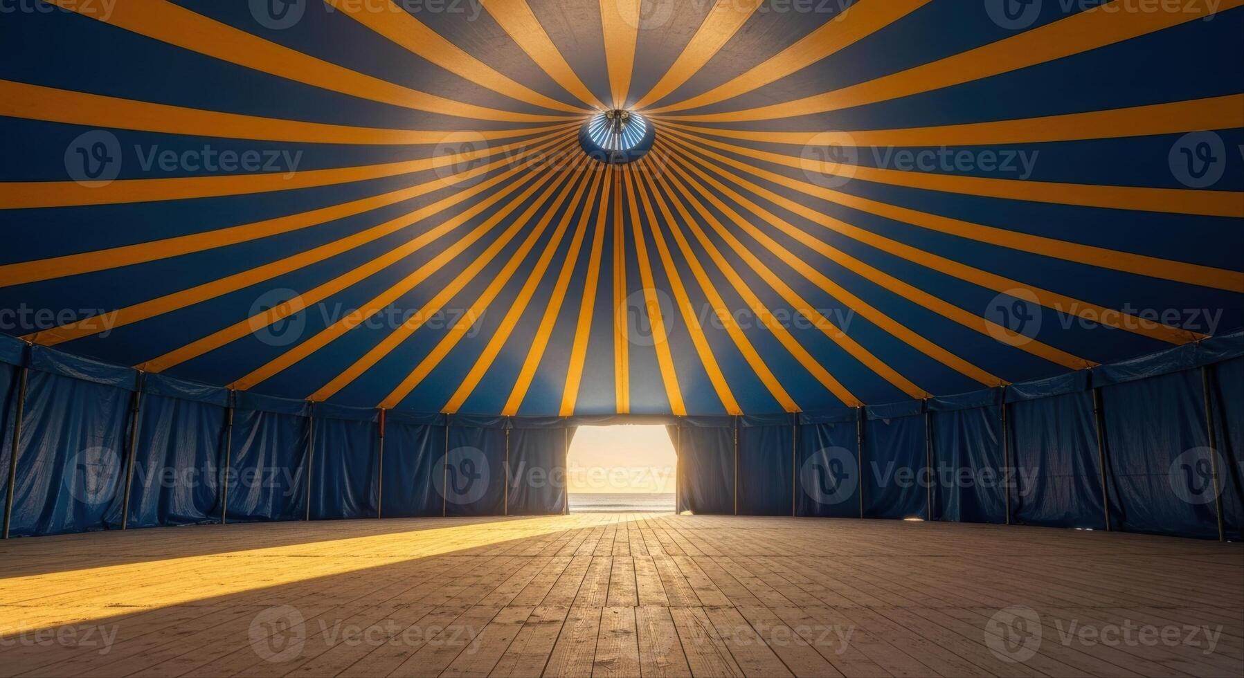Empty grand circus tent interior with blue and yellow stripes and wooden floor photo