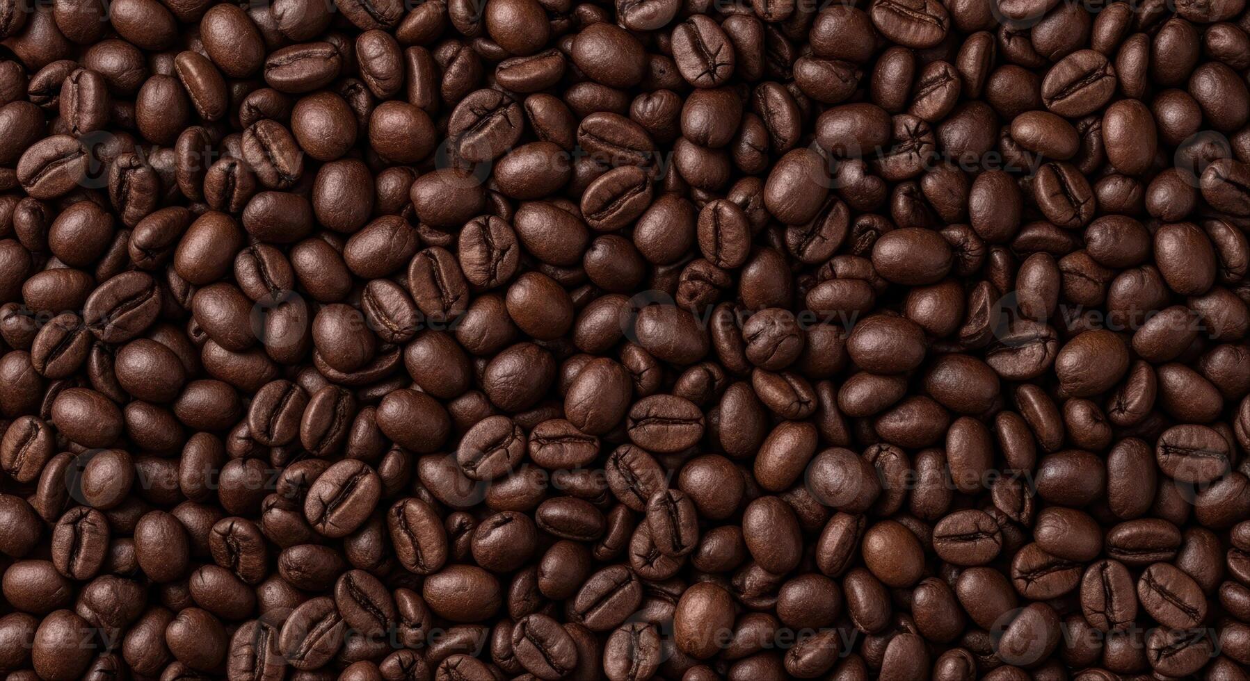 Close up top view of dark roasted coffee beans creating a rich textured background photo