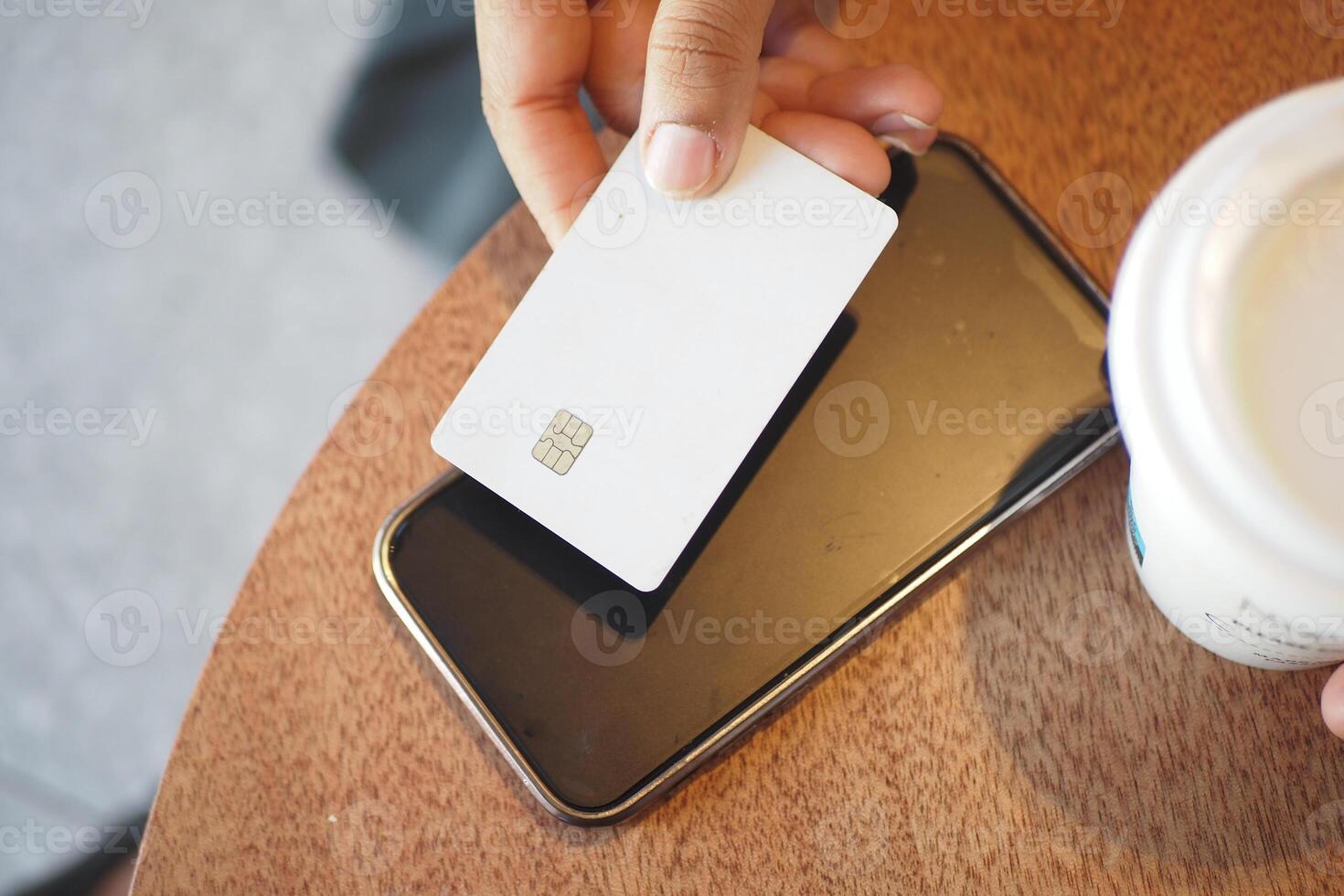 Using contactless payment technology at a cafe photo