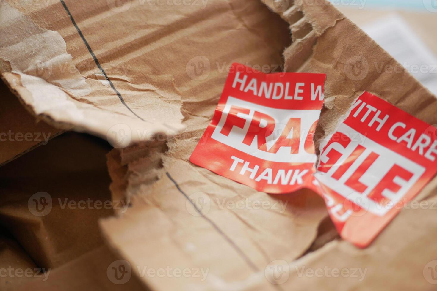 Damaged package with fragile labels shows shipping issues photo