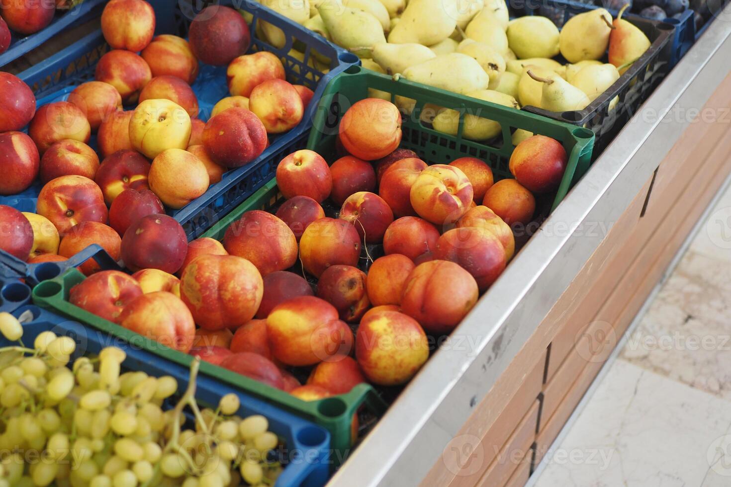 Fresh fruits displayed in market baskets for sale photo