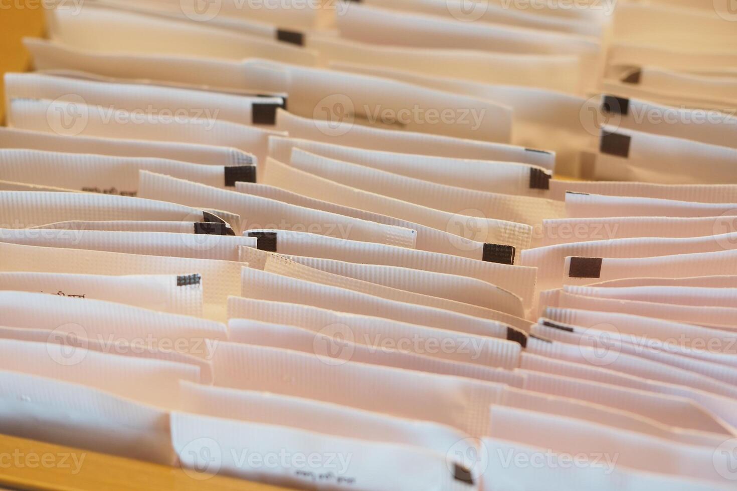 Organized collection of sugar paper packets photo