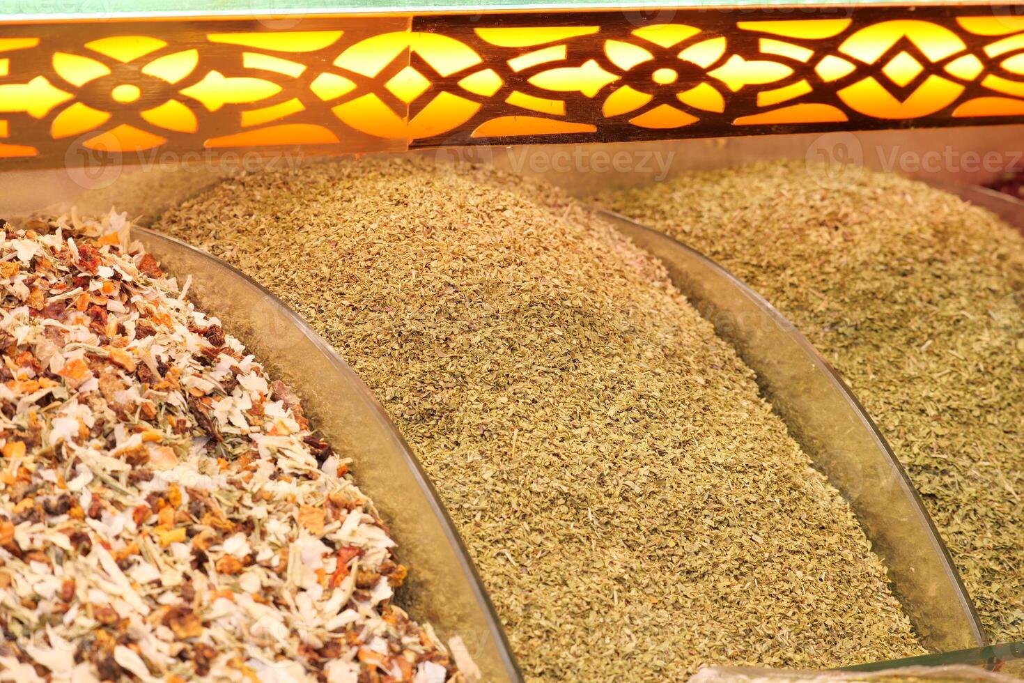 Colorful spices displayed at a vibrant market stall photo