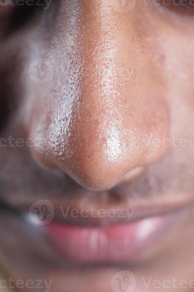 Close-up view of a man's nose and lips during daytime photo