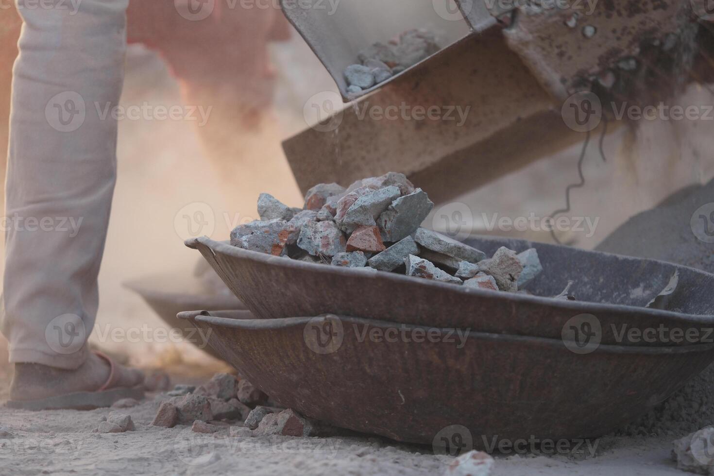 Construction worker loading materials for a building project photo