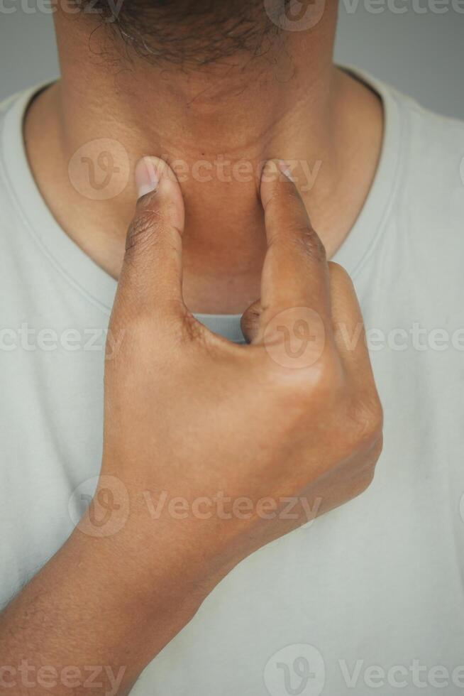 Checking pulse on neck in a calm setting indoors photo