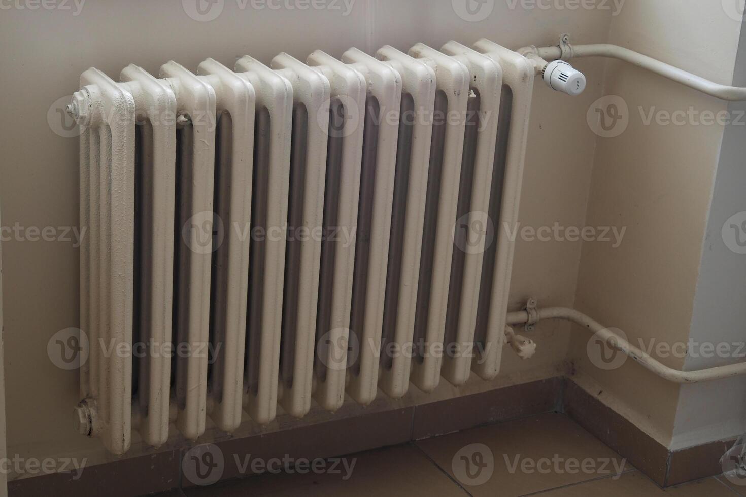 Radiator installed in a room for heating during winter photo