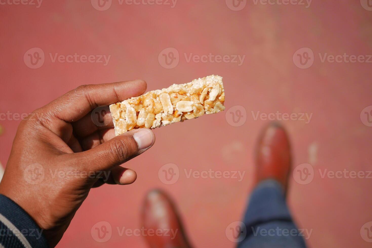 Snack time with a crunchy bar made of nuts photo