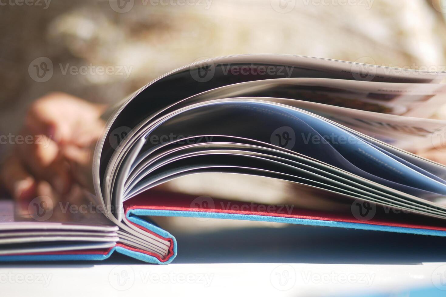 Opened book displaying colorful pages and content photo