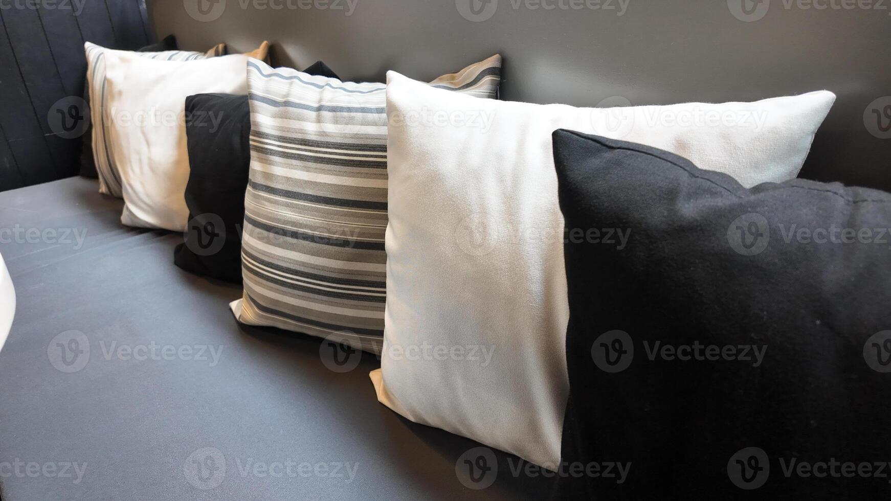 Modern seating arrangement with cushions in a cozy setting photo