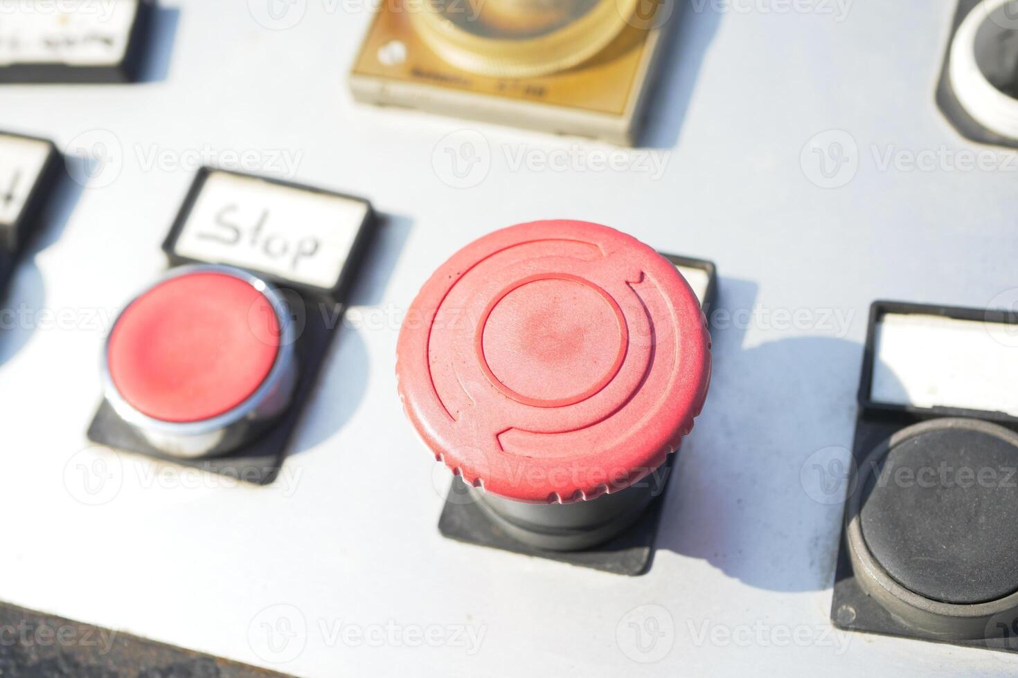 Control panel features prominent red emergency button photo